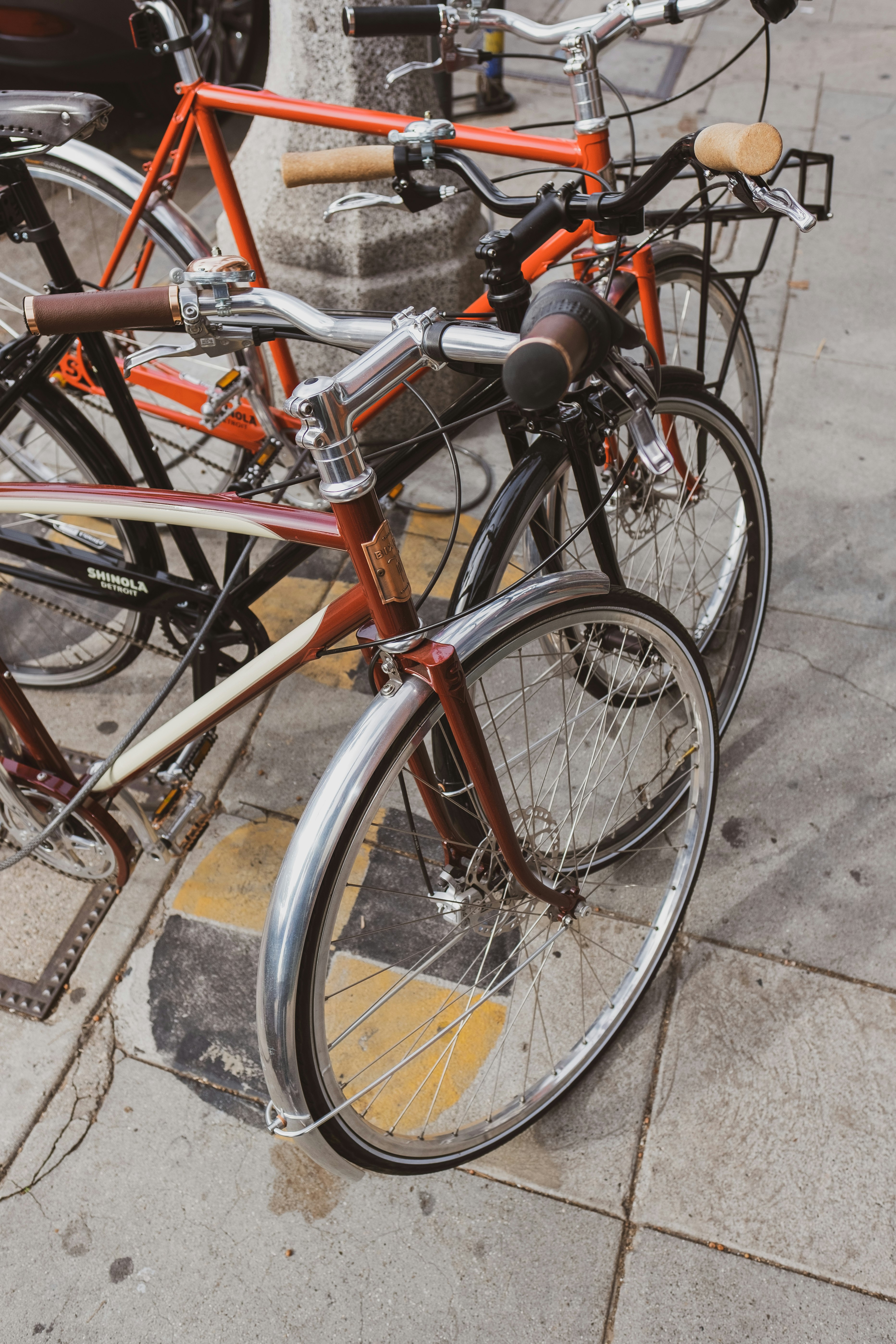 parked bikes on sidewalk during day